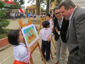 Student presents her painting of road safety