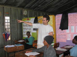 Global Giving's Marc Maxson works with the girls
