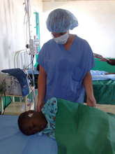Nurse Helps Boy after Surgery
