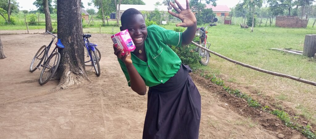 Jane after receiving a pack of sanitary pads