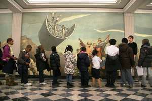Students examining a Mural