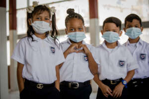 Students with uniform and mask in the School