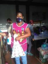 School staff receiving food &personal hygiene bags