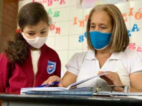 Student and teacher checking an assignment