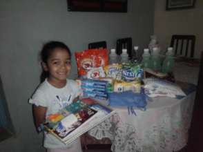 Student with food, hygiene items & school supplies