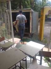 New desks loaded for transport to the Center.
