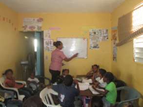 AHCC children receiving tutoring.