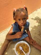 AHCC child eating lunch outside