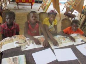 Kids reading in Bereba library