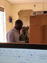 Tender Grassroots volunteer helping students