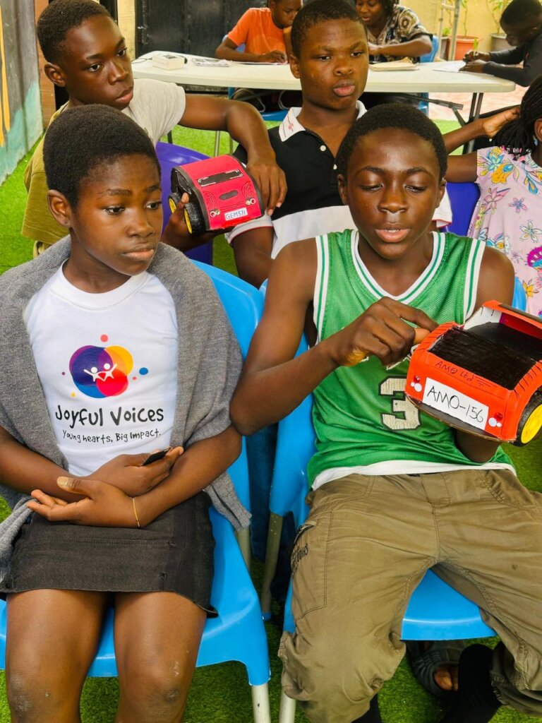 Participants of Art4Humanity with their Inventions