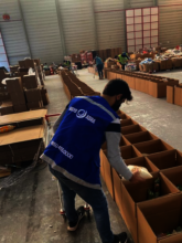 Volunteer preparing supplies for beneficiaries