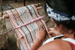 Mrs. Lidia weaving