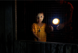 Burmese child with solar LED lamp