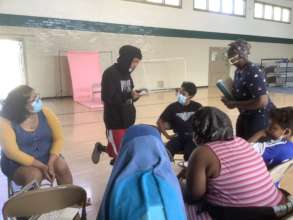 Gabby Jackson encourages teen Chris during pitch.
