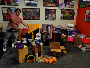 Teen leader Andres shows off donated instruments