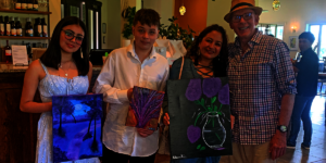 Artists with the collector who purchased their art