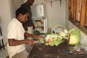 Animal Care givers preparing food for the monkeys