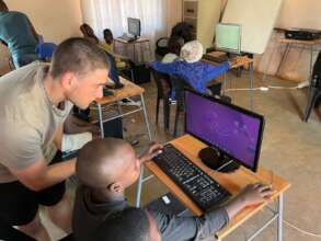 Volunteer guiding a student