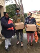 A family receiving a food hamper