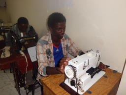 Ermias at his sewing machine