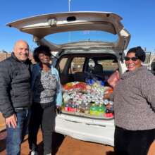 Brian and Maria receiving food