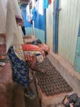 1 of our beneficiary preparing Briquettes to sell.