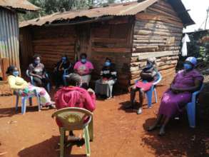 Women in one of their Meetings outside.