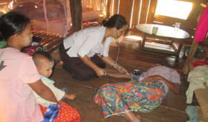 Sister Rosa measures vital sign to AIDS patient
