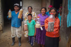 Indigenous family shows their native bean seeds