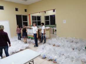 The Red COMAL team prepare emergency kits