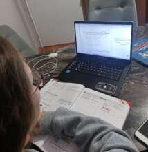 studying with her new laptop