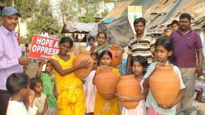 Children and parents happy to receive the pots