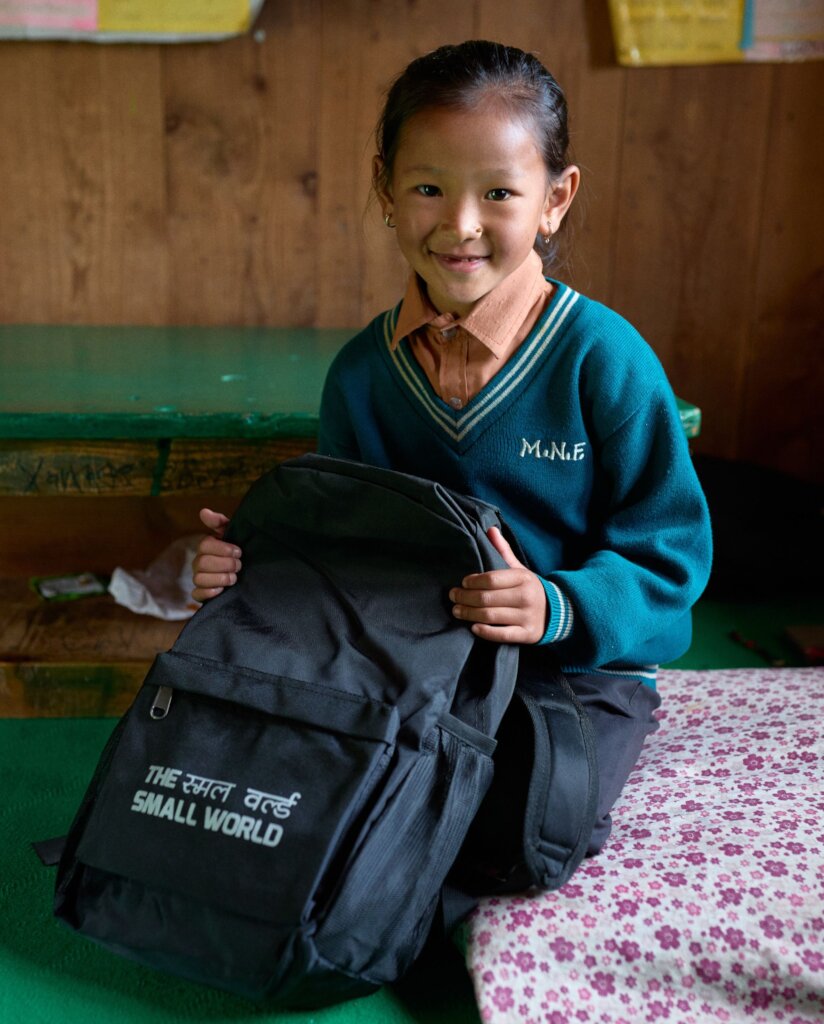 Girls going to school with Support of Small World