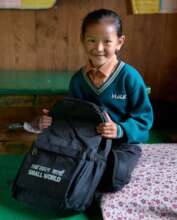 Girls going to school with Support of Small World