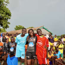 ILA Staff With Students in their new uniforms.