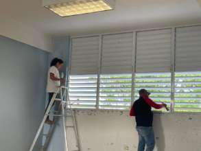 Community memeber painting one of the rooms