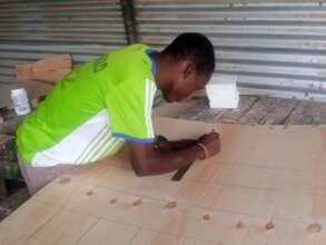 Trainee Victor working on his materials