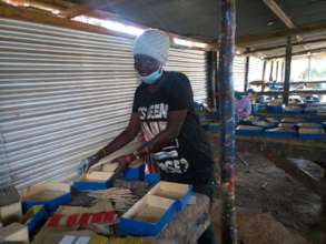 Evelyne making the trays for her materials
