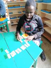 Maureen working with language materials
