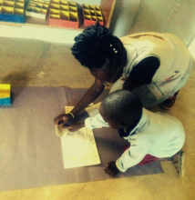 Evelyne working with a child