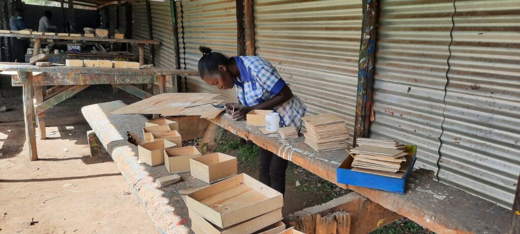 Trainee Gladys working on her materials