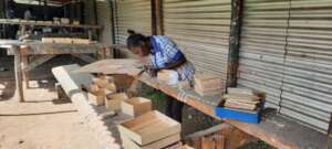 Trainee Gladys working on her materials