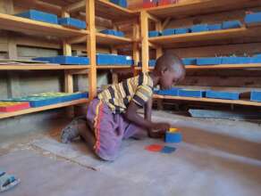 Child working in Montessori classroom in Chesakam