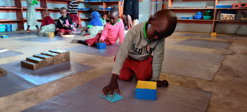 Child working in Montessori classroom