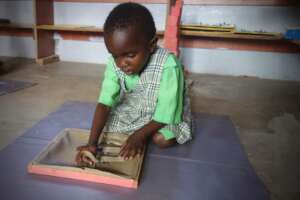 Child working with dressing frame