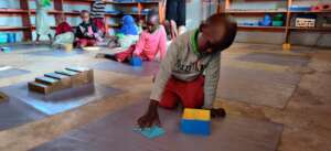 Child working in Montessori classroom
