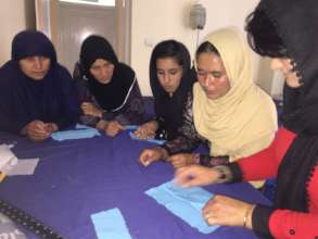Sewing class taught by a teacher