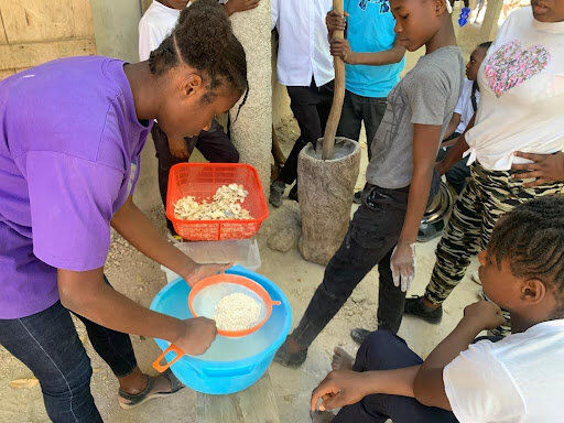 Students learn to make flour from breadfruit.