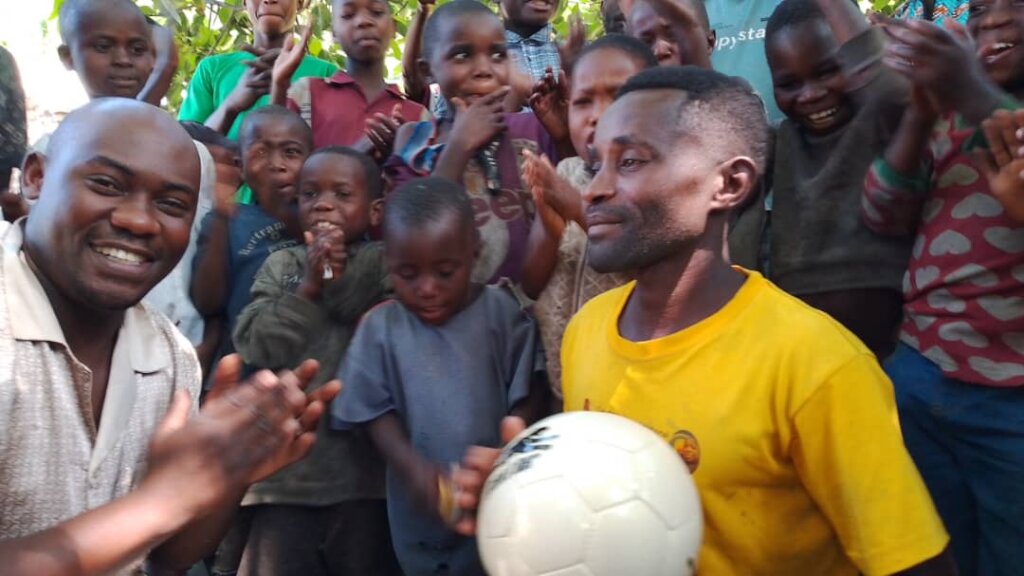 Happy Coach With New Ball